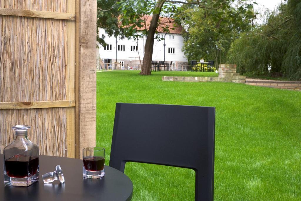 Tuddenham Mill Luxury Hotel Room photo The chair