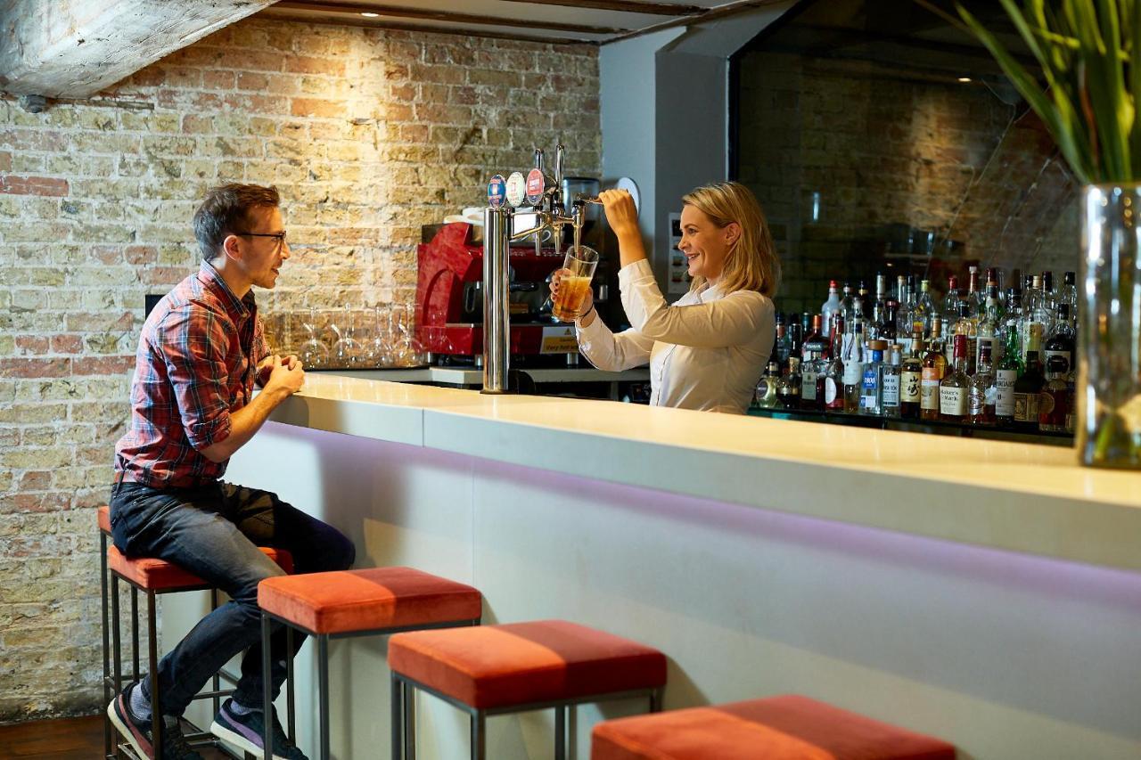Tuddenham Mill Luxury Hotel Exterior photo A bartender at work